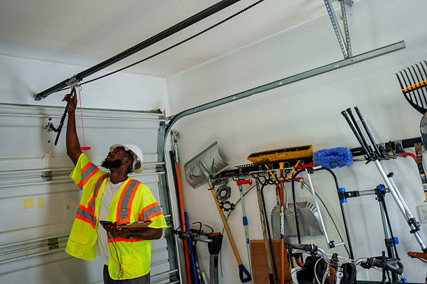 Professional Garage Door Panel Replacement technician working in State Center, IA